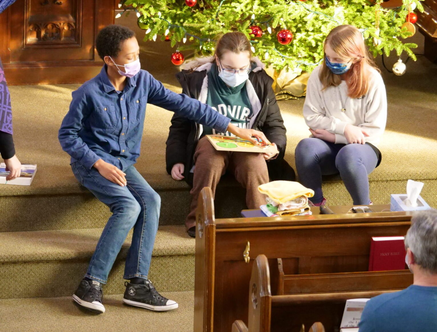 3 Young people on the alter with Pastor Loretta