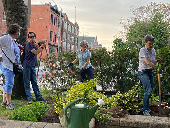 a group of people gardening at Trinity church