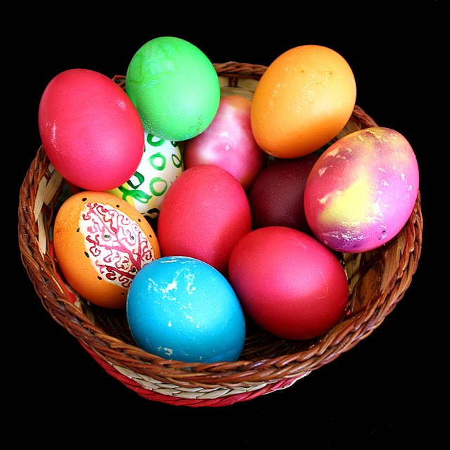 coloured easter eggs in a basket