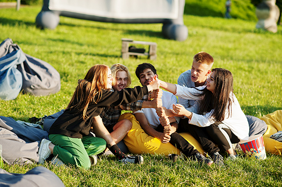teens on grass playing game